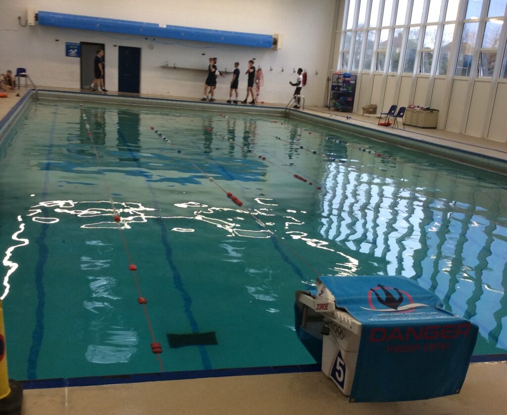 Photo of the swimming pool at Sir Joseph Williamson's Mathematical School being used for the LAT Swimming Gala.