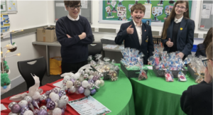 Students posing with their stall